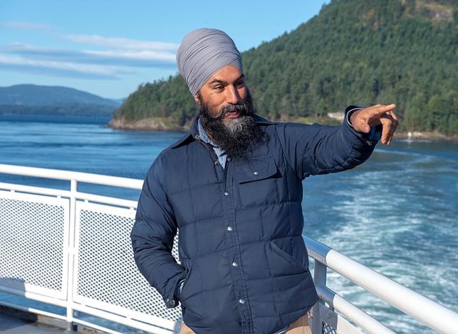 NDP Leader Jagmeet Singh takes in the sights after a media availability as he takes a ferry from Victoria to a campaign event in Vancouver on Saturday, Sept. 28, 2019. THE CANADIAN PRESS/Andrew Vaughan
