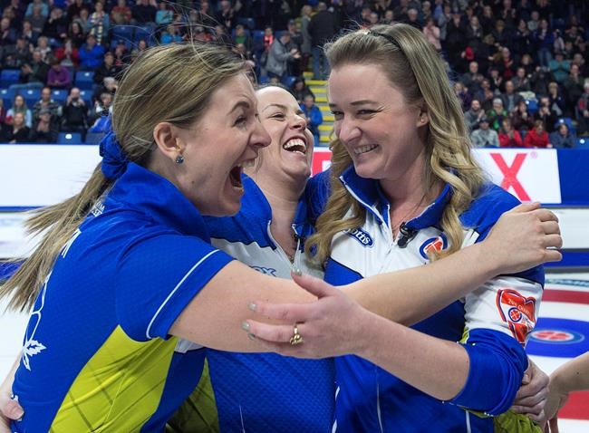 Alberta lead Rachel Brown, second Dana Ferguson and skip Chelsea Carey react after defeating Ontario 8-6 to win the Scotties Tournament of Hearts at Centre 200 in Sydney, N.S. on Sunday, Feb. 24, 2019. THE CANADIAN PRESS/Andrew Vaughan
