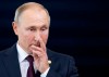 Russia's President Vladimir Putin gestures as he arrives to attend a meeting of leaders of the BRICS emerging economies at the Itamaraty palace in Brasilia, Brazil, Thursday, Nov. 14, 2019. (AP Photo/Pavel Golovkin, Pool)