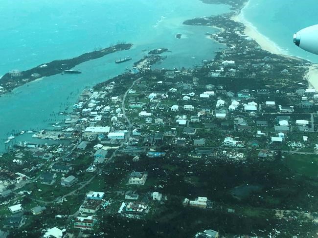 This aerial photo provided by Medic Corps, shows the destruction brought by Hurricane Dorian on Man-o-War Cay, Bahamas, Tuesday, Sept.3, 2019. Relief officials reported scenes of utter ruin in parts of the Bahamas and rushed to deal with an unfolding humanitarian crisis in the wake of Hurricane Dorian, the most powerful storm on record ever to hit the islands. (Medic Corps via AP)