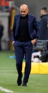 Inter Milan coach Luciano Spalletti walks on the sidelines during a Serie A soccer match between Inter Milan and Lazio, in Milan, Italy, Sunday, March 31, 2019. (AP Photo/Antonio Calanni)