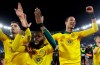 Celtic's Olivier Ntcham, center, celebrates with teammate after scoring his side's winning goal during an Europa League group E soccer match between Lazio and Celtic, in Rome's Olympic Stadium, Thursday, Nov. 7, 2019. Celtics won 2-1. (AP Photo/Gregorio Borgia)