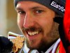 Austria's Marcel Hirscher shows the gold and silver medals of the men's slalom and giant slalom, at the alpine ski World Championships in Are, Sweden, Sunday, Feb. 17, 2019. (AP Photo/Marco Trovati)