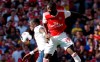 Arsenal's Nicolas Pepe, right, fights for the ball with Tottenham's Moussa Sissoko during their English Premier League soccer match between Arsenal and Tottenham Hotspur at the Emirates stadium in London, Sunday, Sept. 1, 2019. (AP Photo/Alastair Grant)