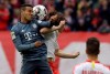 Bayern midfielder Thiago Alcantara, left, jumps for a header with Leipzig's Marcel Sabitzer during the German Bundesliga soccer match between Leipzig and Bayern Munich at the Red Bull Arena stadium in Leipzig, Germany, Saturday, May 11, 2019. (AP Photo/Michael Probst)