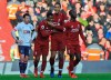 Liverpool's Georginio Wijnaldum, center left, celebrates with Liverpool's Virgil van Dijk, center right, after scoring his side's second goal during the English Premier League soccer match between Liverpool and AFC Bournemouth at Anfield stadium in Liverpool, England, Saturday, Feb. 9, 2019. (AP Photo/Rui Vieira)