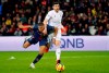 PSG's Kylian Mbappe, left, fights for the ball with Strasbourg's Stefan Mitrovic during the French League One soccer match between Paris-Saint-Germain and Strasbourg at the Parc des Princes stadium in Paris, France, Sunday, April 7, 2019. (AP Photo/Francois Mori)