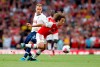 Arsenal's Matteo Guendouzi, right, fights for the ball with Tottenham's Christian Eriksen during their English Premier League soccer match between Arsenal and Tottenham Hotspur at the Emirates stadium in London, Sunday, Sept. 1, 2019. (AP Photo/Alastair Grant)