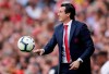The ball approaches Arsenal manager Unai Emery during the English Premier League soccer match between Arsenal and Crystal Palace at the Emirates Stadium in London, Sunday, April 21, 2019. (AP Photo/Tim Ireland)