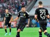 Dortmund's Jadon Sancho, center, celebrates with teammates after scoring his side's opening goal during the German Bundesliga soccer match between FC Cologne and Borussia Dortmund in Cologne, Germany, Friday, Aug.23, 2019. (AP Photo/Martin Meissner)