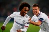 Chelsea's Willian, left, celebrates with Chelsea's Cesar Azpilicueta after scoring his side's second goal during the group H Champions League soccer match between Lille and Chelsea at the Stade Pierre Mauroy - Villeneuve d'Ascq stadium in Lille, France, Wednesday, Oct. 2, 2019. (AP Photo/Michel Spingler)