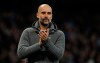Manchester City manager Pep Guardiola greets supporters at the end of the English Premier League soccer match between Manchester City and Leicester City at the Etihad stadium in Manchester, England, Monday, May 6, 2019. (AP Photo/Rui Vieira)