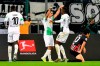 Moenchengladbach's Denis Zakaria, center right, celebrates after scoring his side's fourth goal during the German Bundesliga soccer match between Borussia Moenchenglabach and Eintracht Frankfurt in Moenchengladbach, Germany, Sunday Oct. 27, 2019. (AP Photo/Martin Meissner)