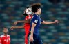 Japan's forward Takumi Minamind, right, is airborne with Oman's midfielder Harib Al-Saadi during the AFC Asian Cup group F soccer match between Japan and Oman at Zayed Sports City Stadium in Abu Dhabi, United Arab Emirates, Sunday, Jan. 13, 2019. (AP Photo/Hassan Ammar)