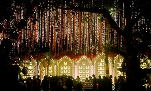 A street is lit-up outside the house of Reliance Industries Chairman Mukesh Ambani ahead of the wedding of his daughter Isha in Mumbai, India, Tuesday, Dec. 11, 2018. Isha Ambani, the daughter of India‚Äôs richest mogul, is to wed Anand Piramal, the son of one of India‚Äôs biggest industrialists, at the Ambani estate in Mumbai on Wednesday, capping off an extravagant days-long event. (AP Photo/Rajanish Kakade)