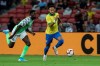 Brazil's Neymar Jr, right, and Nigeria's Anderson Esiti go for the ball during the international friendly match between Brazil and Nigeria in Singapore, Sunday, Oct. 13, 2019. (AP Photo/Danial Hakim)