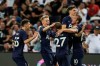 Tottenham's Harry Kane celebrates with his teammates after scoring a goal during the International Champions Cup soccer match between Juventus and Tottenham Hotspur in Singapore, Sunday, July 21, 2019. (AP Photo/Danial Hakim)