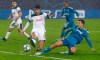Lokomotiv's Vedran Corluka, left, fights for the ball with Juventus' Paulo Dybala during the Champions League Group D soccer match between Lokomotiv Moscow and Juventus at the Lokomotiv Stadium in Moscow, Russia, Wednesday, Nov. 6, 2019. (AP Photo/Pavel Golovkin)