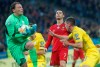 Ukraine's goalkeeper Andriy Pyatov, left, catches the ball after struggling with Portugal's Cristiano Ronaldo, centre, during the Euro 2020 group B qualifying soccer match between Ukraine and Portugal at the Olympiyskiy stadium in Kyiv, Ukraine, Monday, Oct. 14, 2019. (AP Photo/Efrem Lukatsky)
