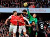 Crystal Palace's goalkeeper Wayne Hennessey makes a save in front of Arsenal's Sokratis Papastathopoulos, left, and Arsenal's Granit Xhaka, second left, during the English Premier League soccer match between Arsenal and Crystal Palace at the Emirates stadium in London, Sunday, Oct. 27, 2019. (AP Photo/Leila Coker)