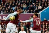 Aston Villa's Wesley, left, heads the ball during the English Premier League soccer match between Aston Villa and Liverpool at Villa Park in Birmingham, England, Saturday, Nov. 2, 2019. (AP Photo/Rui Vieira)