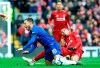 Chelsea's Eden Hazard, left, duels for the ball with Liverpool's Fabinho during the English Premier League soccer match between Liverpool and Chelsea at Anfield stadium in Liverpool, England, Sunday, April 14, 2019. (AP Photo/Rui Vieira)