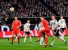 Serbia's Luka Jovic, third right, scores his side's opening goal during a international friendly soccer match between Germany and Serbia at the Volkswagen Arena stadium in Wolfsburg, Germany, Wednesday, March 20, 2019. (AP Photo/Martin Meissner)