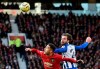 Manchester United's Andreas Pereira, left, jumps for the ball with Brighton's Davy Proepper during the English Premier League soccer match between Manchester United and Brighton and Hove Albion, at the Old Trafford stadium in Manchester, England, , Sunday, Nov. 10, 2019. (AP Photo/Rui Vieira)
