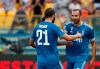 Juventus' Giorgio Chiellini, right, celebrates with teammates after scoring his side's opening goal during the Serie A soccer match between Parma and Juventus at the Tardini stadium, in Parma, Italy, Saturday, Aug. 24, 2019. (AP Photo/Antonio Calanni)