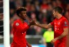 Bayern's Kingsley Coman, left, celebrates with Bayern's Robert Lewandowski after scoring his side's opening goal during the Champions League group B first round soccer match between FC Bayern Munich and Red Star Belgrade, in Munich, Germany, Wednesday, Sept. 18, 2019. (AP Photo/Matthias Schrader)