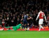 Manchester United's Alexis Sanchez, right, scores his side's opening goal during the English FA Cup fourth round soccer match between Arsenal and Manchester United at the Emirates stadium in London, Friday, Jan. 25, 2019. (AP Photo/Matt Dunham)