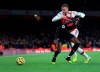 Crystal Palace's Wilfried Zaha, front, duels for the ball with Arsenal's Calum Chambers during the English Premier League soccer match between Arsenal and Crystal Palace at the Emirates stadium in London, Sunday, Oct. 27, 2019. (AP Photo/Leila Coker)