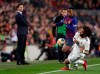 Real defender Marcelo, right, duels for the ball with Barcelona defender Nelson Semedo during the Copa del Rey semifinal first leg soccer match between FC Barcelona and Real Madrid at the Camp Nou stadium in Barcelona, Spain, Wednesday Feb. 6, 2019. (AP Photo/Manu Fernandez)
