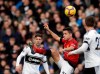 Manchester United's Ander Herrera, center, duels for the ball with Fulham's Luciano Vietto, left, and Joe Bryan during the English Premier League soccer match between Fulham and Manchester United at Craven Cottage stadium in London, Saturday, Feb. 9, 2019. (AP Photo/Matt Dunham)