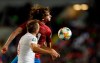 England's Harry Kane, front, jumps for the ball with Czech Republic's Alex Kral during the Euro 2020 group A qualifying soccer match between Czech Republic and England at the Sinobo stadium in Prague, Czech Republic, Friday, Oct. 11, 2019. (AP Photo/Petr David Josek)