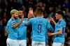 Manchester City's Sergio Aguero, left, celebrates with teammates after scoring his side's third goal during the English League Cup soccer match between Manchester City and Southampton at Etihad stadium in Manchester, England, Tuesday, Oct. 29, 2019. (AP Photo/Rui Vieira)
