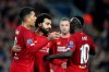Liverpool's Mohamed Salah, second left, celebrates with teammates after scoring his side's third goal during the Champions League group E soccer match between Liverpool and Red Bull Salzburg at Anfield stadium in Liverpool, England, Wednesday, Oct. 2, 2019. (AP Photo/Jon Super)