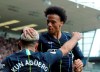 Manchester City's Sergio Aguero, left, celebrates with Manchester City's Leroy Sane after scoring his side's opening goal during the English Premier League soccer match between Burnley and Manchester City at Turf Moor in Burnley, England, Sunday, April 28, 2019. (AP Photo/Rui Vieira)