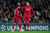 Liverpool's Mohamed Salah, left, celebrates with Liverpool's Virgil van Dijk after scoring his side's second goal during the Champions League quarterfinals, 2nd leg, soccer match between FC Porto and Liverpool at the Dragao stadium in Porto, Portugal, Wednesday, April 17, 2019. (AP Photo/Luis Vieira)