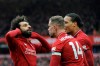 Liverpool's Mohamed Salah, left, celebrates with teammates after scoring his side's second goal during the English Premier League soccer match between Liverpool and Chelsea at Anfield stadium in Liverpool, England, Sunday, April 14, 2019. (AP Photo/Rui Vieira)