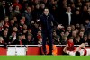Arsenal's head coach Unai Emery, center, looks Arsenal's Laurent Koscielny lies on the pitch during the English FA Cup fourth round soccer match between Arsenal and Manchester United at the Emirates stadium in London, Friday, Jan. 25, 2019. (AP Photo/Matt Dunham)