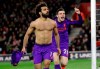 Liverpool's Mohamed Salah, left, celebrates after scoring his side's second goal during the English Premier League soccer match between Southampton and Liverpool at St Mary's stadium in Southampton, England Friday, April 5, 2019. (AP Photo/Kirsty Wigglesworth)