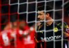 Dortmund's goalkeeper Roman Buerki reacts after Dortmund's Mats Hummels scores an own goal during the German Bundesliga soccer match between FC Bayern Munich and Borussia Dortmund, in Munich, Germany, Saturday, Nov. 9, 2019. (AP Photo/Matthias Schrader)