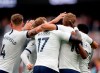 Tottenham's Harry Kane celebrates with teammates after scoring his side's third goal during the English Premier League soccer match between Tottenham Hotspur and Aston Villa at the Tottenham Hotspur stadium in London, Saturday, Aug. 10, 2019. (AP Photo/Frank Augstein)