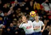Tottenham's Christian Eriksen, center, jumps for the ball during the English Premier League soccer match between Tottenham Hotspur and Bournemouth at Wembley stadium in London, Wednesday, Dec. 26, 2018. (AP Photo/Tim Ireland)