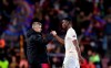 Manchester United coach Ole Gunnar Solskjaer, left, shakes hands with Manchester United's Paul Pogba at the end of the Champions League quarterfinal, second leg, soccer match between FC Barcelona and Manchester United at the Camp Nou stadium in Barcelona, Spain, Tuesday, April 16, 2019. (AP Photo/Manu Fernandez)