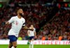 England's Raheem Sterling celebrates after scoring his side's fourth goal during the Euro 2020 group A qualifying soccer match between England and the Czech Republic at Wembley stadium in London, Friday March 22, 2019. (AP Photo/Tim Ireland)