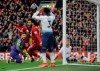 Liverpool's Mohamed Salah, center, celebrates after Tottenham's Toby Alderweireld scores an own goal past his goalkeeper during the English Premier League soccer match between Liverpool and Tottenham Hotspur at Anfield stadium in Liverpool, England, Sunday, March 31, 2019. (AP Photo/Rui Vieira)