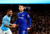Manchester City's Raheem Sterling, left, celebrates after scoring his side's sixth goal during the English Premier League soccer match between Manchester City and Chelsea at Etihad stadium in Manchester, England, Sunday, Feb. 10, 2019. (AP Photo/Jon Super)