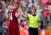 Referee Stephanie Frappart of France, right, discusses with Liverpool's Jordan Henderson during the UEFA Super Cup soccer match between Liverpool and Chelsea, in Besiktas Park, in Istanbul, Wednesday, Aug. 14, 2019. (AP Photo)